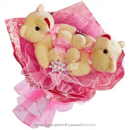 2 Teddies in a bouquet with pink wrapping
