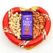 250 gms cashews 250 gms almonds with chocolates in a tray