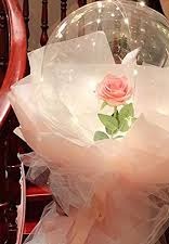 Clear transparent bubble with pink rose pink wrapping