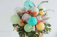 20 green yellow orange balloons with flowers and leaves green blue wrapping