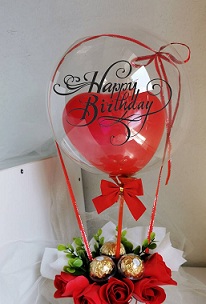 Ferrero rocher bouquet with birthday bobo balloon red roses and heart balloon inside