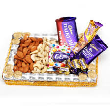 250 gms cashews 250 gms almonds with chocolates in a tray