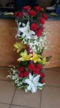 2 Feet arrangement of White and Yellow Lilies Red Carnations and rajnigandha