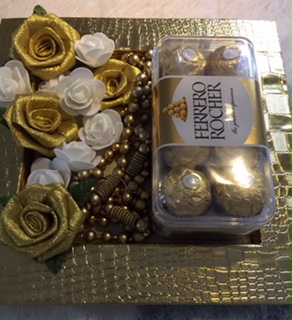 Golden decorated tray with 16 ferrero rocher chocolates