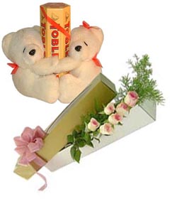 2 teddies with 6 roses and tobler chocolates