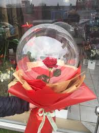 1 transparent balloon 1 red rose arrangement with red wrapping Only for Pune and Mumbai