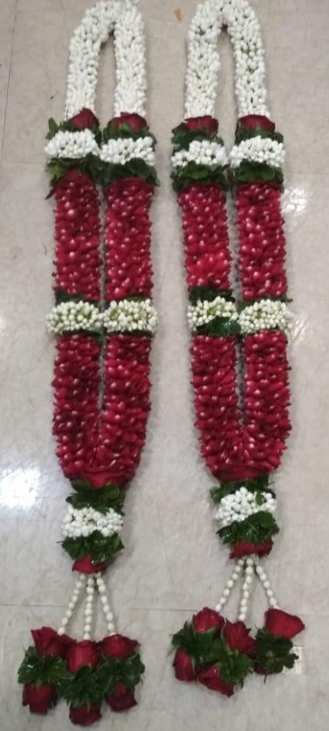 2 garlands with red white flowers and beads