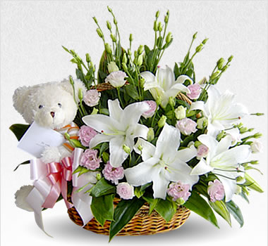 Lilies and Teddy bear in a basket