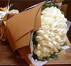 50 white roses with brown wrapping