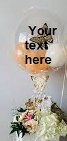Transparent Balloon Printed WITH YOUR TEXT in 3 words only stuffed with 3 pink balloons Tied with ribbons to a basket of 12 Pink Roses