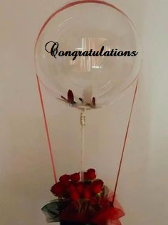 CONGRATULATIONS printed transparent balloon with 8 red roses arrangement Only for Pune